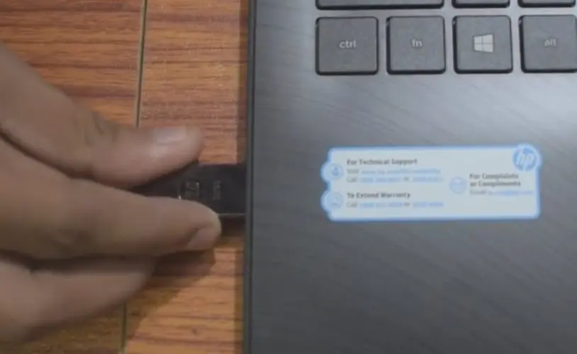 plug the bootable USB drive in your HP Laptop