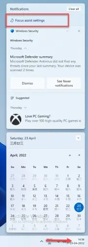 Click on the date and time icon on the taskbar and select focus assit settings