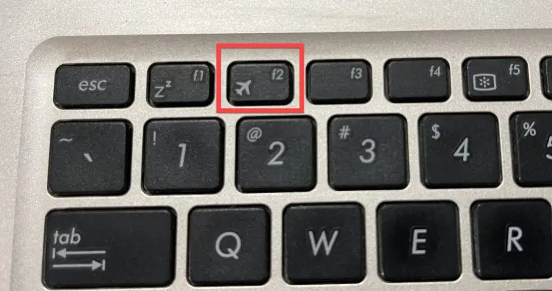 Turn on your laptop and start pressing the F2 key